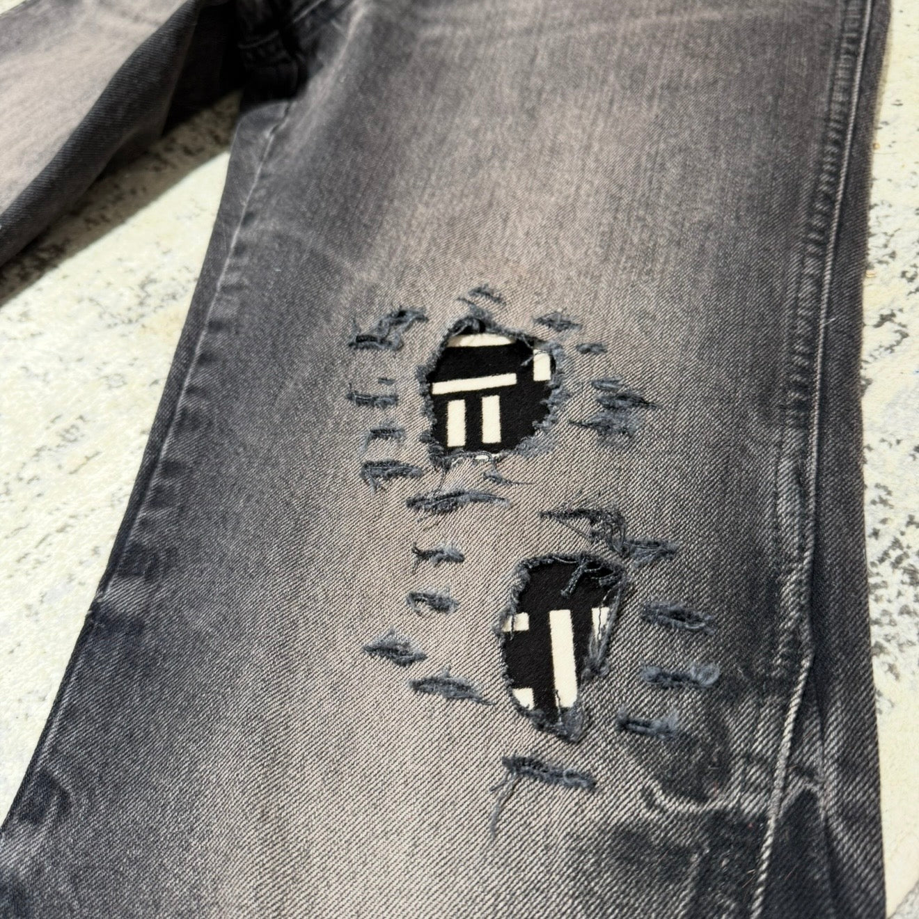 BLACK AND WHITE PONY HAIR PATCH FLARE DENIM