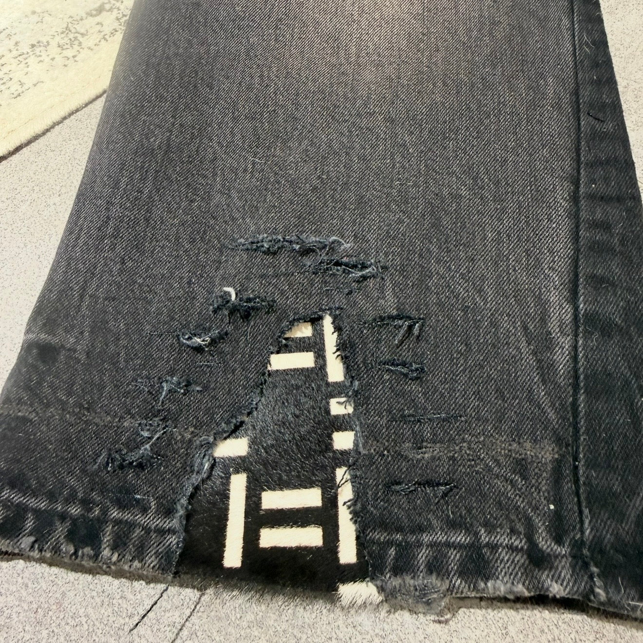 BLACK AND WHITE PONY HAIR PATCH FLARE DENIM